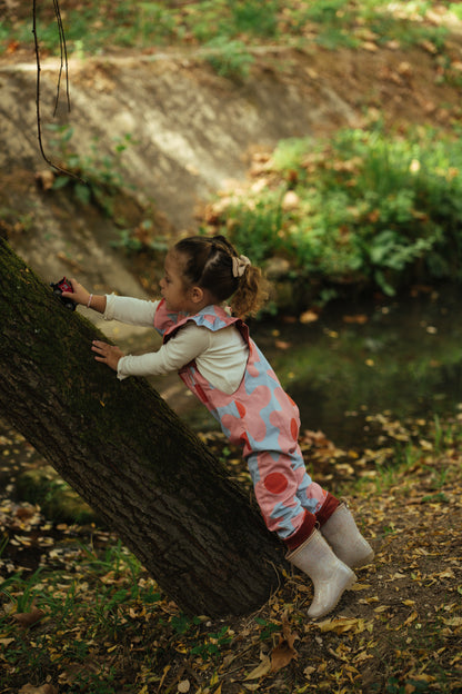 Kid playing; overalls; jumpsuit; dungaree